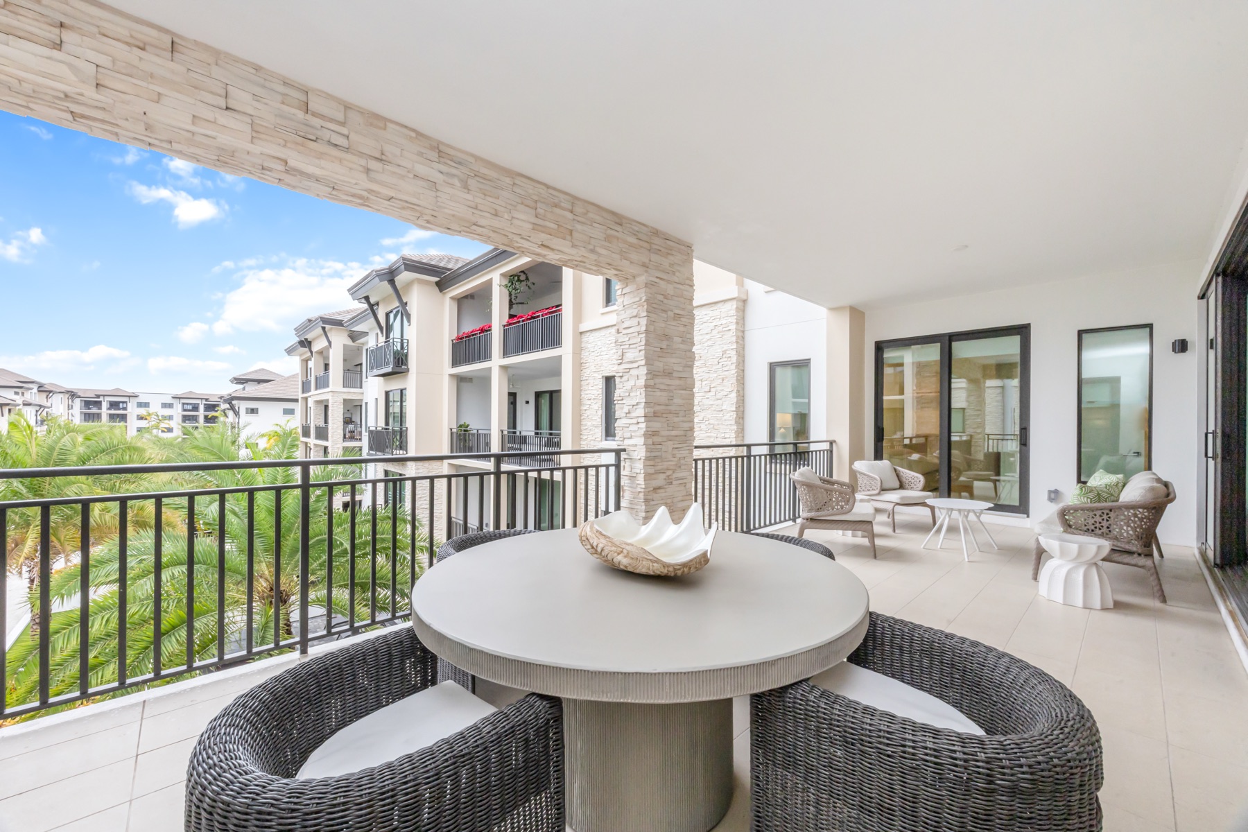 Large private balcony with landscaped courtyard views