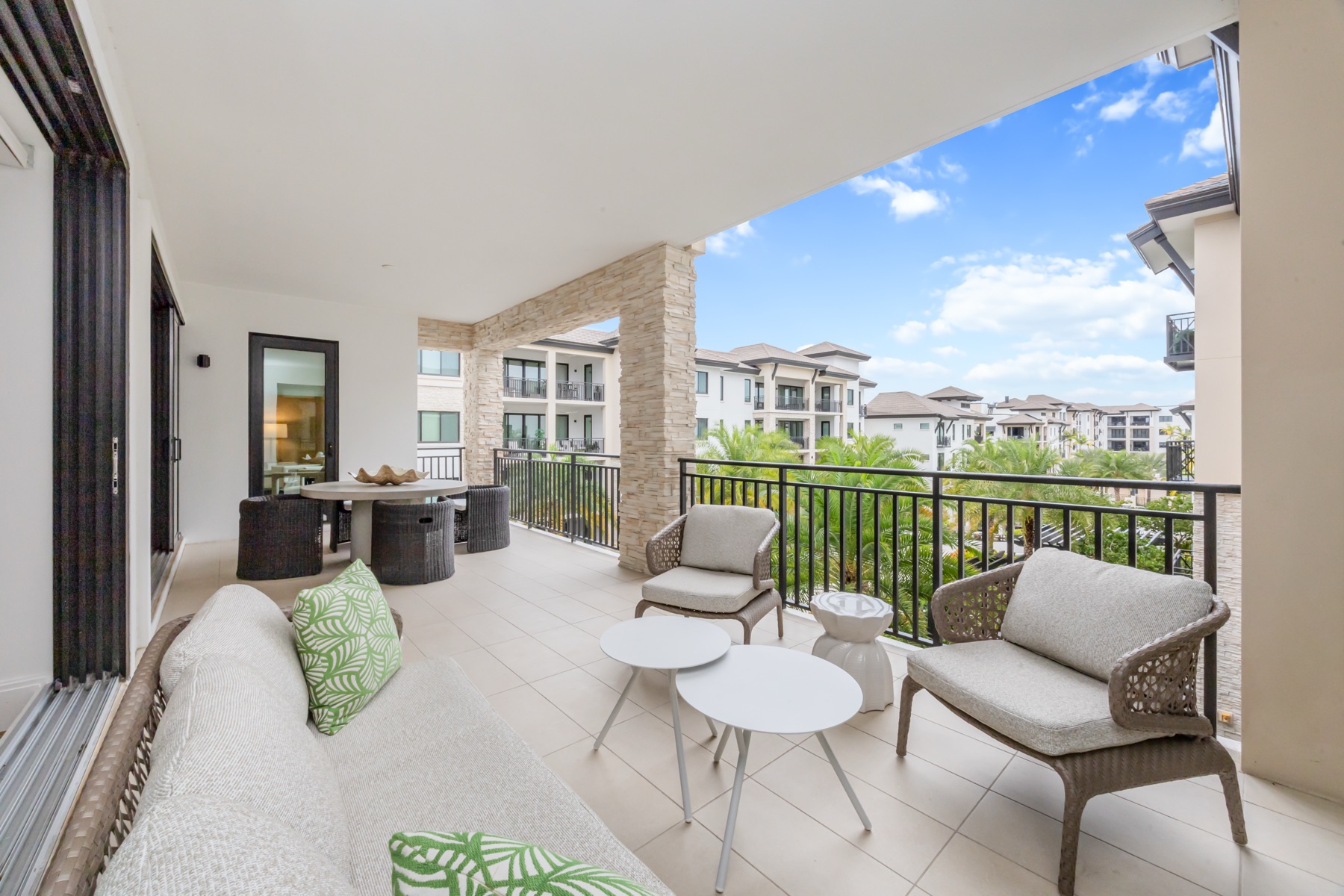 South-facing private balcony with courtyard views