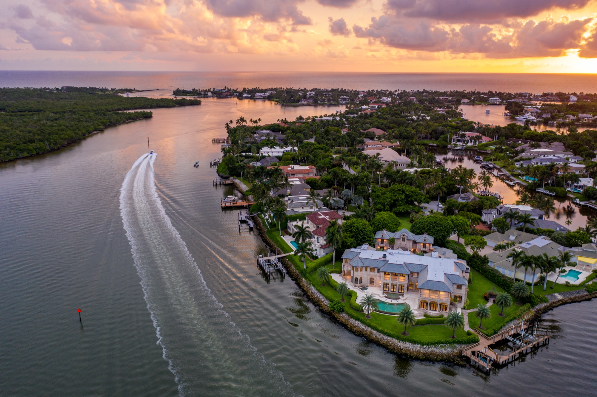 Waterfront estate aerial at golden hour — 1000 Admiralty Parade